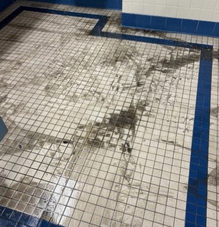 Restroom tile floor, before
