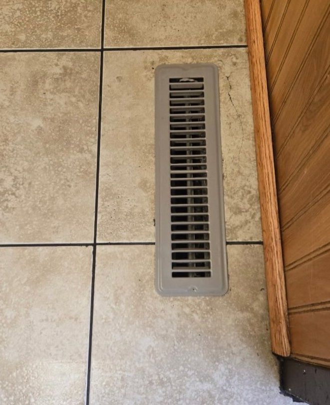 Tile at a floor vent, after