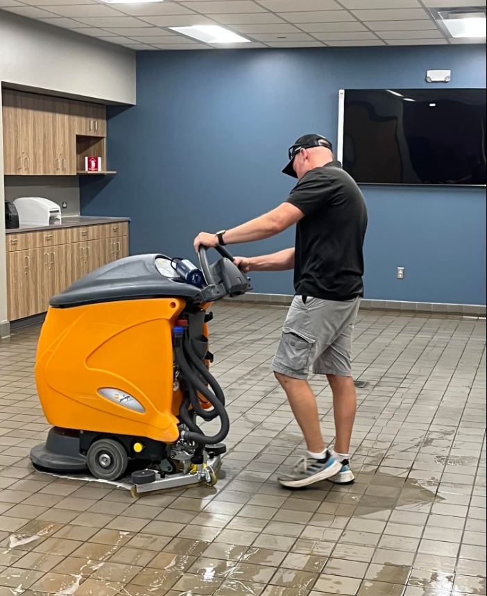 Jeff running the floor scrubber