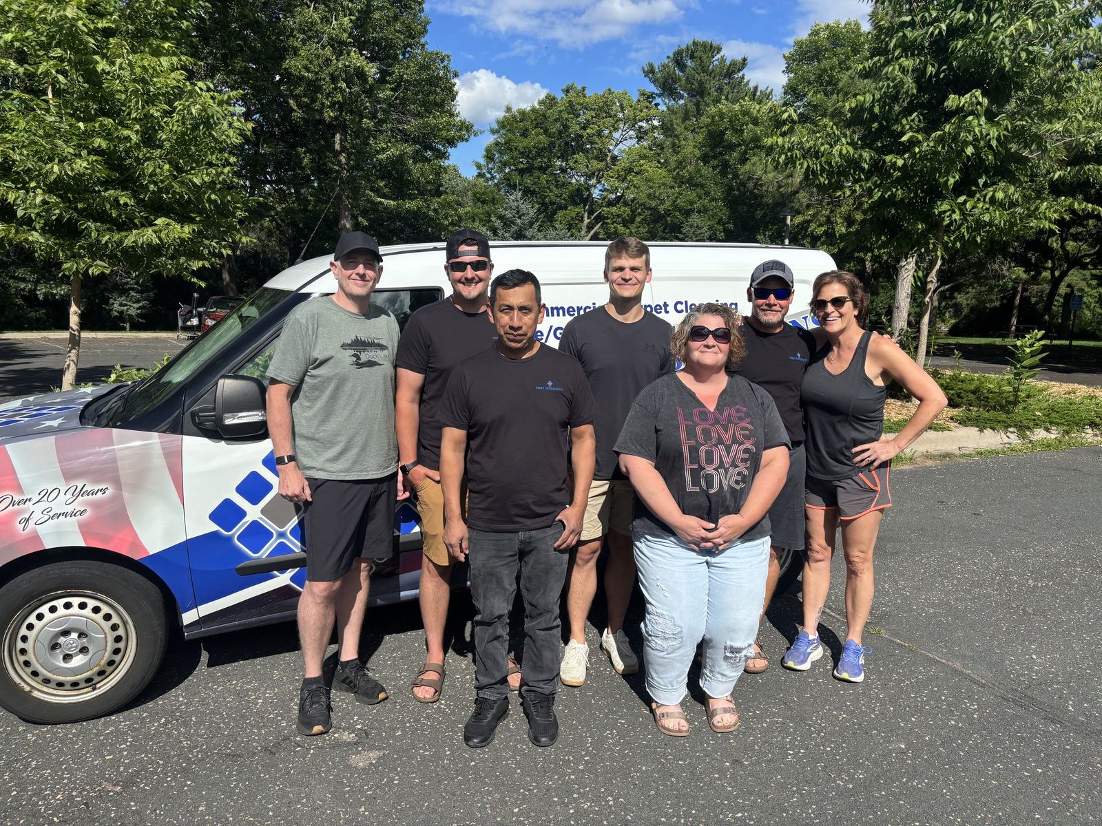 The First Impressions crew with their company van